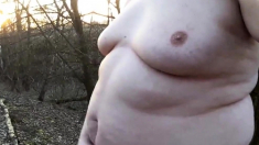 Chubby masturbates in the woods