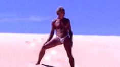 Tanned guy on beach in tiny string thong (temporarily!)
