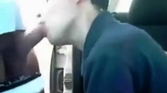 Sucking a cock seated in his car